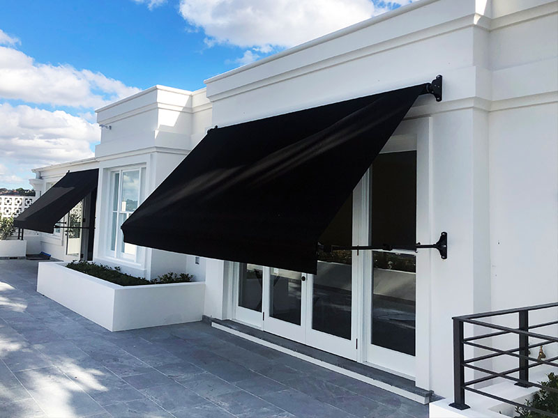 PIVOT ARM AND DROP ARM RETRACTABLE AWNINGS