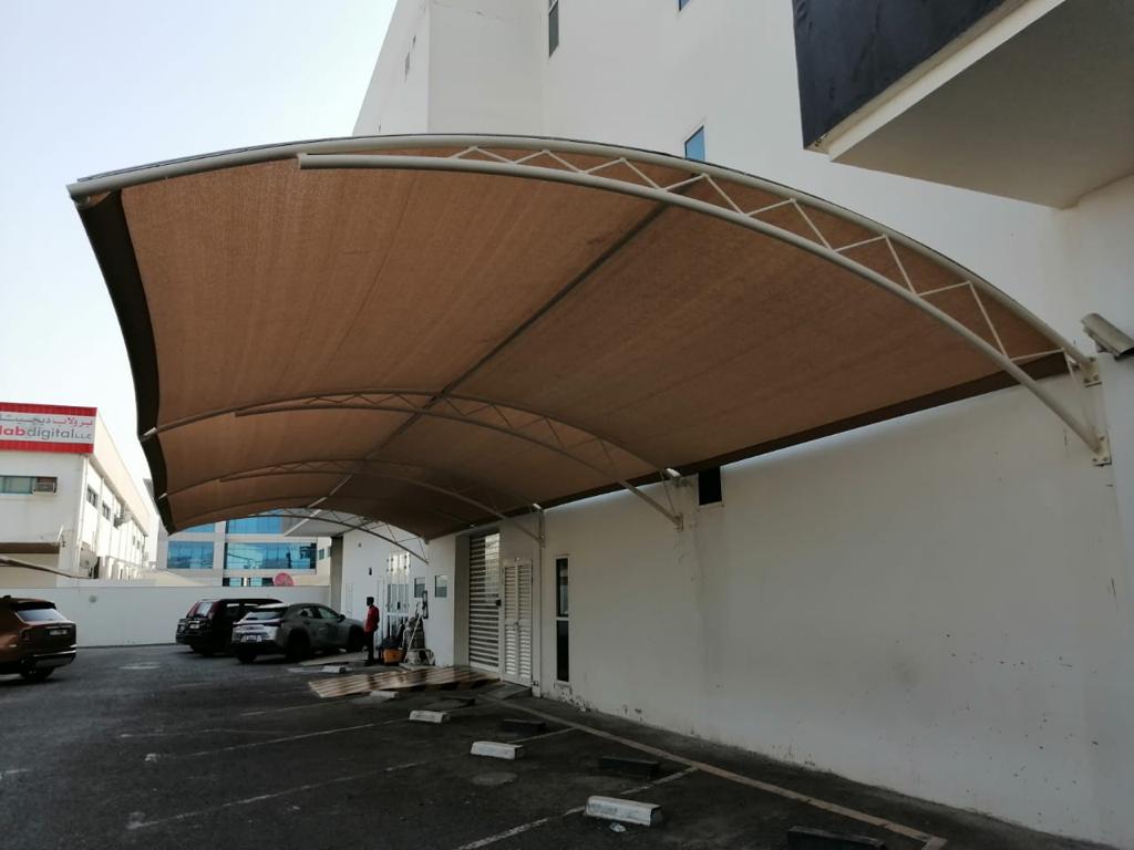 WALL MOUNTED CAR SHADE-FREESTANDING CAR SHADE-A CAR SHADE WITHOUT VERTICAL POLES-CAR PARK SHADES MADE IN KENYA-CAR WASH SHADE-VEHICLE PARKING SHADE-CARPORT-VEHICLE SHADE COVER