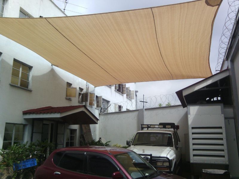 SHADE SAILS ATTACHED TO EXISTING ROOFS AND WALLS-PARKING SHADE SAHDE SAIL SOLUTIONS