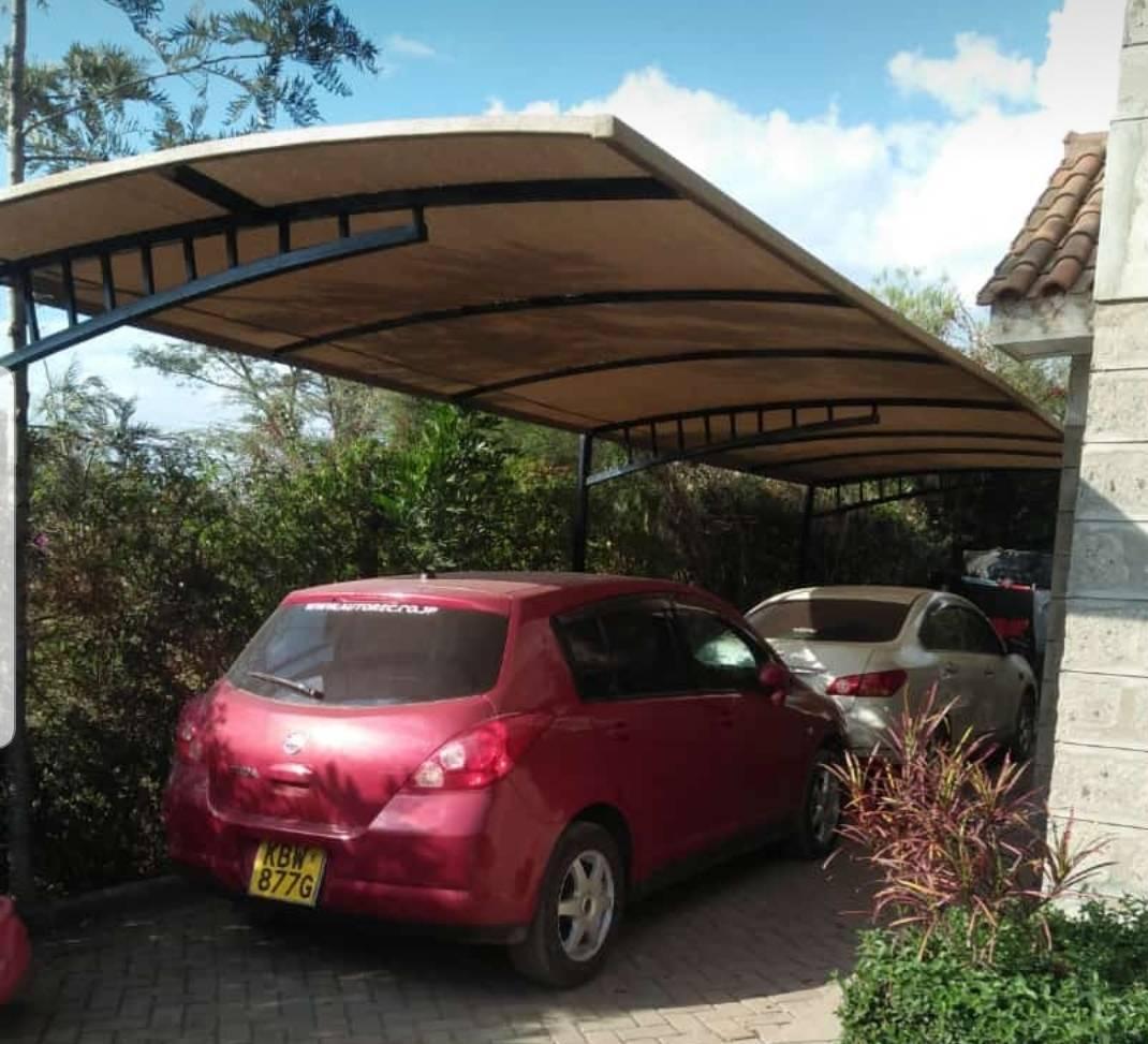 Modern-Carport-Installer-RUNDA-NAIROBI-Curved-Design-Car-Shade-Waterproof-Green-Shade-Net-Canopy-Vehicle Parking-Shade-Luxury-Outdoor-Shade-Parking-Tent-Garage