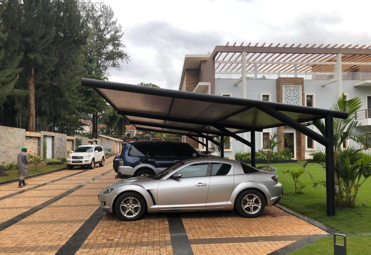 Modern Carport Installer in Runda Nairobi-Curved Design Car Shade-Waterproof Green Shade Net Canopy-Vehicle Parking Shade-Luxury Outdoor Shade-Parking Tent-Garage