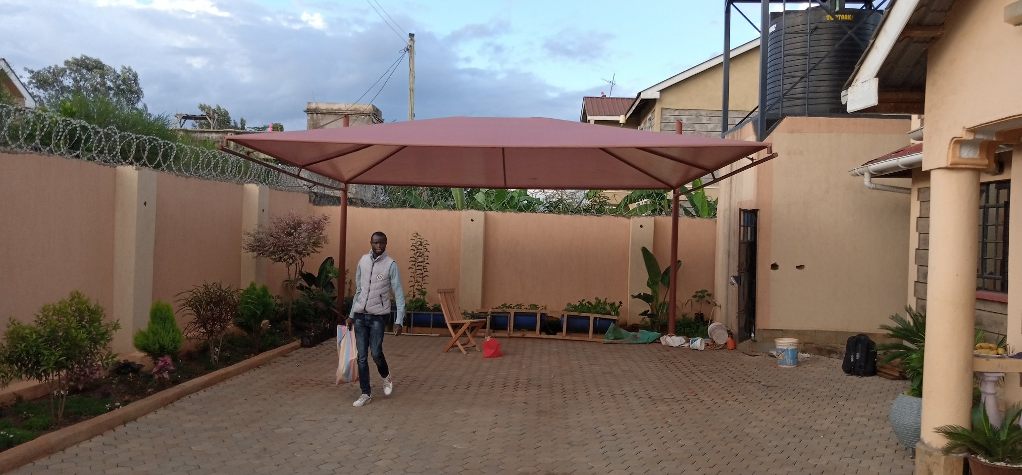 Unique and Modern Car Wash Shades and Carports-Yard Parking Lot Shades-Parking Shades-Vehicle Shade Canopies-Cantilever and Curved Shed designs-Waterproof Shade Net Car Covers-Commercial and Residential Car Shade Installers in Murang’a Kenya-