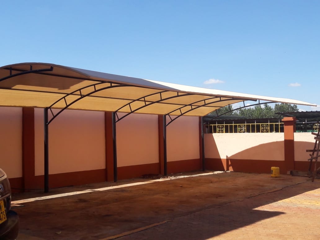 Quality and affordable Car Sheds-Unique and Modern Car Wash Shades and Carports-Yard Parking Lot Shades-Parking Shades-Vehicle Shade Canopies-Cantilever and Curved Shed designs-Waterproof Shade Net Car Covers- Car Park Shades For Banks-Schools-Library Buildings-Cultural Centers-Police Posts-Military and Army Barracks-Churches-Mosques-Hospitals-Restaurants-Hotels-Resorts-Villas-Homes-Townhouses-Offices-Airports-Factories-Garages-Businnes Parks-Law Firm Offices-Corporate Offices-Commercial and Residential-Car Shade Construction Company In Nairobi Kenya-We install the CARPORTS all over the country including RUNDA-GARDEN ESTATE-RIDGEWAYS-THOME-MUTHAIGA-KITUSURU-LORESHO-KYUNA-REDHILL-NYARI-PEPONI ROAD-THIGIRI RIDGE-SPRING VALLEY-RIVERSIDE-Chiromo-WESTLANDS-PARKLANDS-HIGHRIDGE-UPPERHILL-JAMES GICHURU ROAD-LAVINGTON-KILELESHWA-KILIMANI-Milimani-HURLINGHAM-NGONG-KAREN-Ngong Road-LANG’ATA-NAIROBI WEST-NGUMO-MBAGATHI-RONGAI-KISERIAN-INDUSTRIAL AREA-SOUTH C-SOUTH B-MOMBASA ROAD-KITENGELA-ATHIRIVER-KATANI-SYOKIMAU-MACHAKOS-MAANZONI-LUKENYA-NAIVASHA-NAKURU-ELDORET-KISUMU-SIAYA-THIKA ROAD-KAHAWA WENDANI-KAMITI ROAD-JACARANDA-TATU CITY-KIJANI RIDGE-MEMBLEY-KAMAKIS-RUIRU-JUJA-THIKA-THIKA GREENS-KENYATTA ROAD-RUAKA-BANANA-MUCHATHA-KIAMBAA-KARURA-KIKUYU-LIMURU-KIAMBU-UTAWALA-RUAI-KAMULU-JOSKA-EMBAKASI-NYAHURURU-NANYUKI-NARUMORU-TIMAU-ISIOLO-MERU-EMBU-KERUGOYA-KUTUS-NYANDARUA-NYERI-MURANG’A-KARATINA-MANDERA-NAROK-MOMBASA-NYALI-BAMBURI-VIPINGO RIDGE-VIPINGO CITY-KAJIADO-NAROK-GILGIL-NJABINI-KINANGOP-OL KALOU-TIGONI- Waterproof Carports Installers-Affordable Car Parking Shades For Sale in Kenya-Quality Car Parking Shade Supplier and Manufacturing Company-Best Priced Car Parking Shade Solutions in Kenya