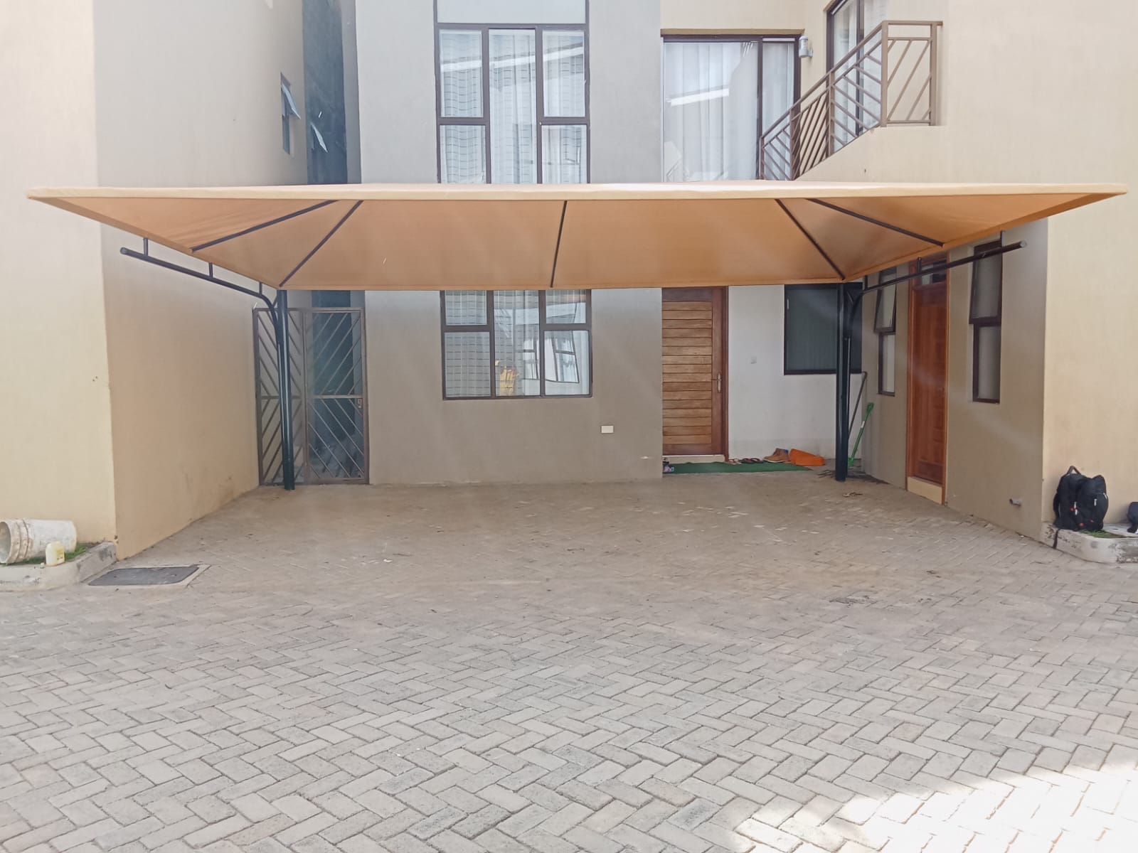 Fabrication and Installation of carports and waterproof parking shades in Fairfield Park Estate- Syokimau